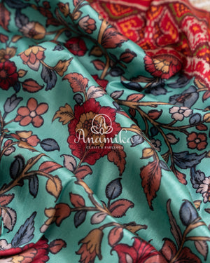 Blue Kalamkari Digital Print on crepe silk with a beautifully designed red blouse