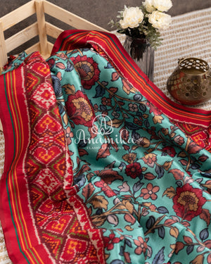 Blue Kalamkari Digital Print on crepe silk with a beautifully designed red blouse