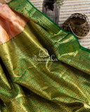 Peach Kanchipattu saree with contrast dark green blouse with heavy zardosi work