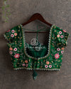 Peach Kanchipattu saree with contrast dark green blouse with heavy zardosi work