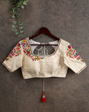 Off white blouse with beautiful thread embroidery on sleeves and shoulder