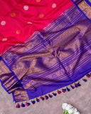 Reddish Pink Checkered Gadwal Pattu saree with a contrast dark blue puff sleeves blouse