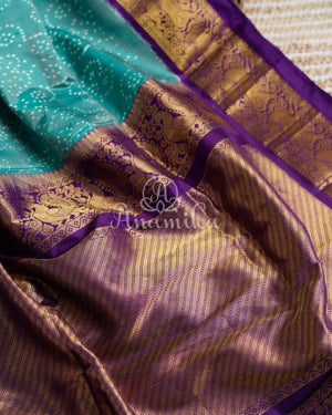 Teal Blue Twill Ikkat Saree with purple kanchi and patola borders