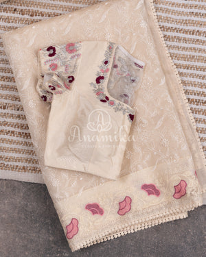 Porcelain White Organza saree with all over chikankari work and a stunning designer blouse