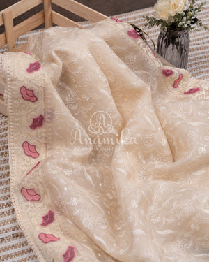 Porcelain White Organza saree with all over chikankari work and a stunning designer blouse