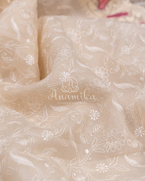 Porcelain White Organza saree with all over chikankari work and a stunning designer blouse