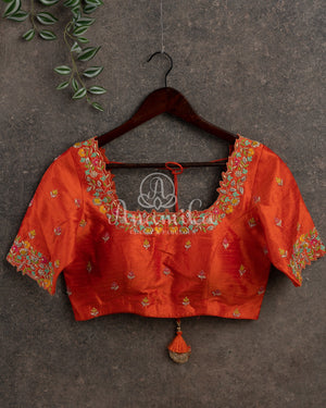 Orange color blouse with multi color thread and zardosi work