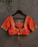 Orange color blouse with multi color thread and zardosi work