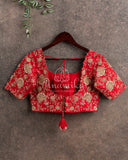 Red heavy work blouse with intricately designed zardosi work