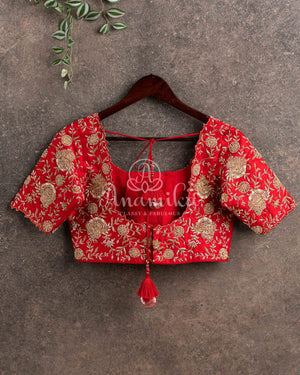 Red heavy work blouse with intricately designed zardosi work