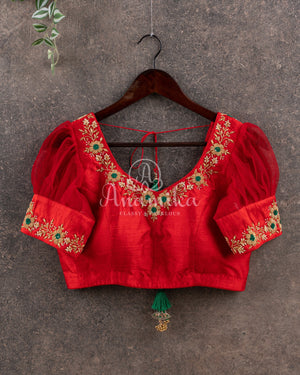 Dark Green Ikkat Patola saree with kanchi border - and a contemporary puff sleeves blouse