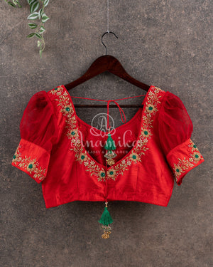 Dark Green Ikkat Patola saree with kanchi border - and a contemporary puff sleeves blouse