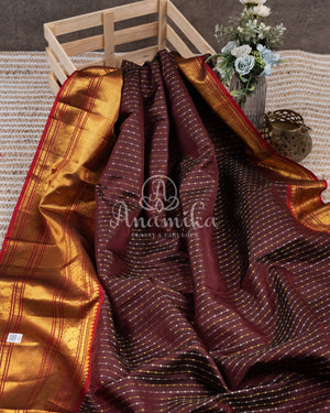 Kanchipattu saree in Dark Maroon color with a contrast red border