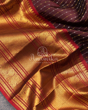 Kanchipattu saree in Dark Maroon color with a contrast red border