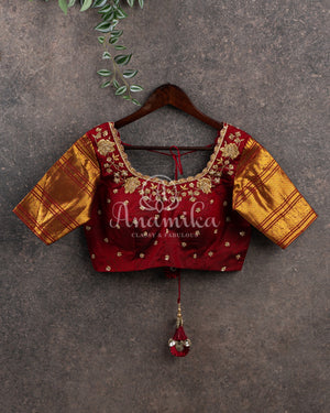 Kanchipattu saree in Dark Maroon color with a contrast red border