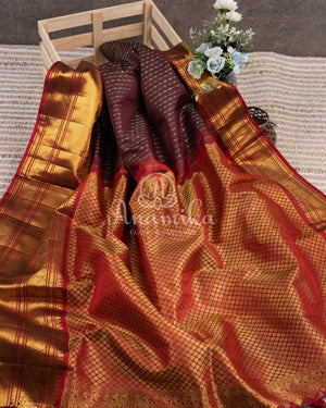 Kanchipattu saree in Dark Maroon color with a contrast red border