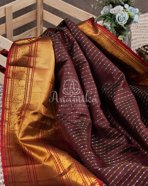 Kanchipattu saree in Dark Maroon color with a contrast red border
