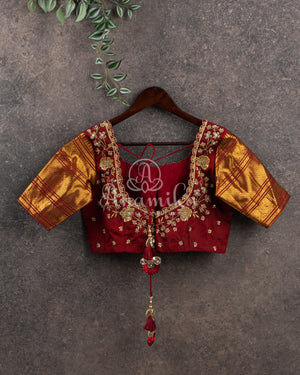 Kanchipattu saree in Dark Maroon color with a contrast red border