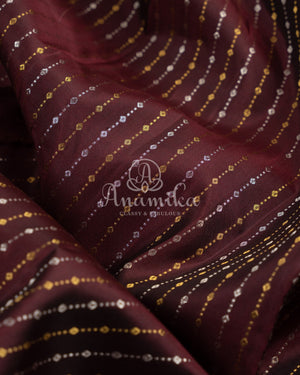 Kanchipattu saree in Dark Maroon color with a contrast red border