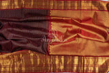 Kanchipattu saree in Dark Maroon color with a contrast red border