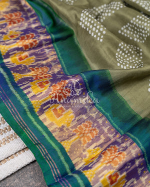 Pure silk bandini saree in shades of green/turquoise with a patola border and pallu