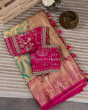 A pure kanjeevaram tissue saree with a contrast tomato pink color heavy work blouse