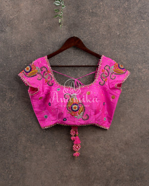 Purple Banarasi georgette saree with floral jaal design paired with contrast pink blouse