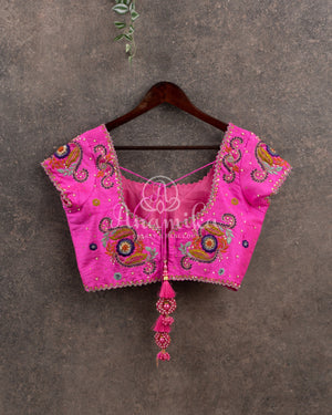 Purple Banarasi georgette saree with floral jaal design paired with contrast pink blouse