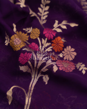 Purple Banarasi georgette saree with floral jaal design paired with contrast pink blouse