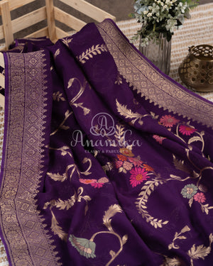 Purple Banarasi georgette saree with floral jaal design paired with contrast pink blouse