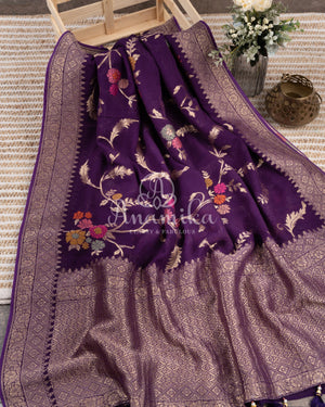 Purple Banarasi georgette saree with floral jaal design paired with contrast pink blouse