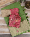 Parrot Green Silk Kota saree with a contrast peach pink floral blouse