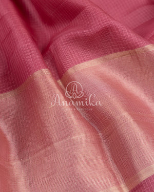 Peach Pink Silk Kota saree with a contrast powder blue floral blouse