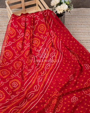 Red Crepe Bandini saree with contrast off white puff sleeves blouse