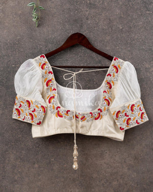 Red Crepe Bandini saree with contrast off white puff sleeves blouse