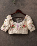 Off white blouse with multi color thread embroidery