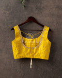 Yellow Sleeveless blouse with simple yet elegant gold work
