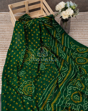 Dark Green Bandini Crepe saree with a contrast yellow blouse