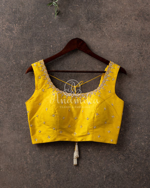 Dark Green Bandini Crepe saree with a contrast yellow blouse