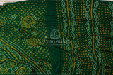 Dark Green Bandini Crepe saree with a contrast yellow blouse