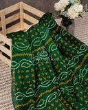 Dark Green Bandini Crepe saree with a contrast yellow blouse