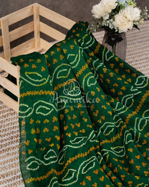 Dark Green Bandini Crepe saree with a contrast yellow blouse