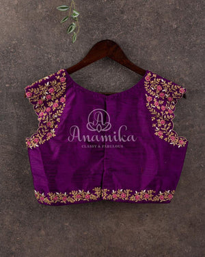Purple broad shoulder sleeveless blouse with intricately designed handwork