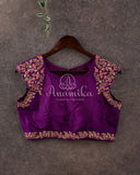 Purple broad shoulder sleeveless blouse with intricately designed handwork