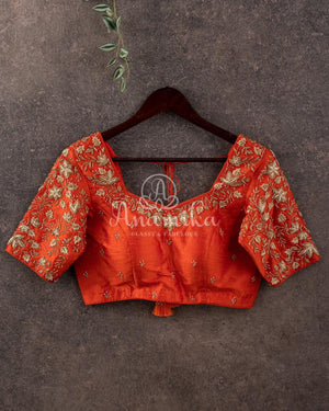 Orange Elbow sleeves blouse with beautiful gold embroidery.