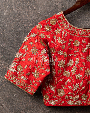 Red heavy bridal work blouse with intricately designed zardosi work