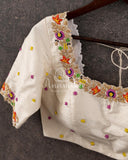Off white blouse with beautifully designed multi color thread embroidery