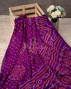 Purple Bandini Crepe saree with a mono tone purple off shoulder blouse