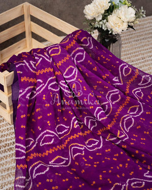 Purple Bandini Crepe saree with a mono tone purple off shoulder blouse