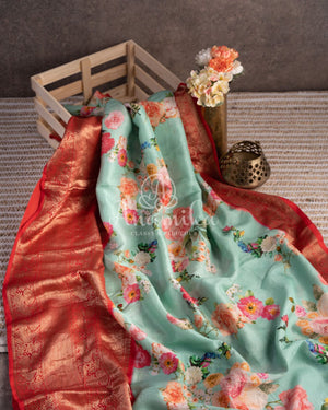 Stunning Floral Kanchi saree in a sea green red combo